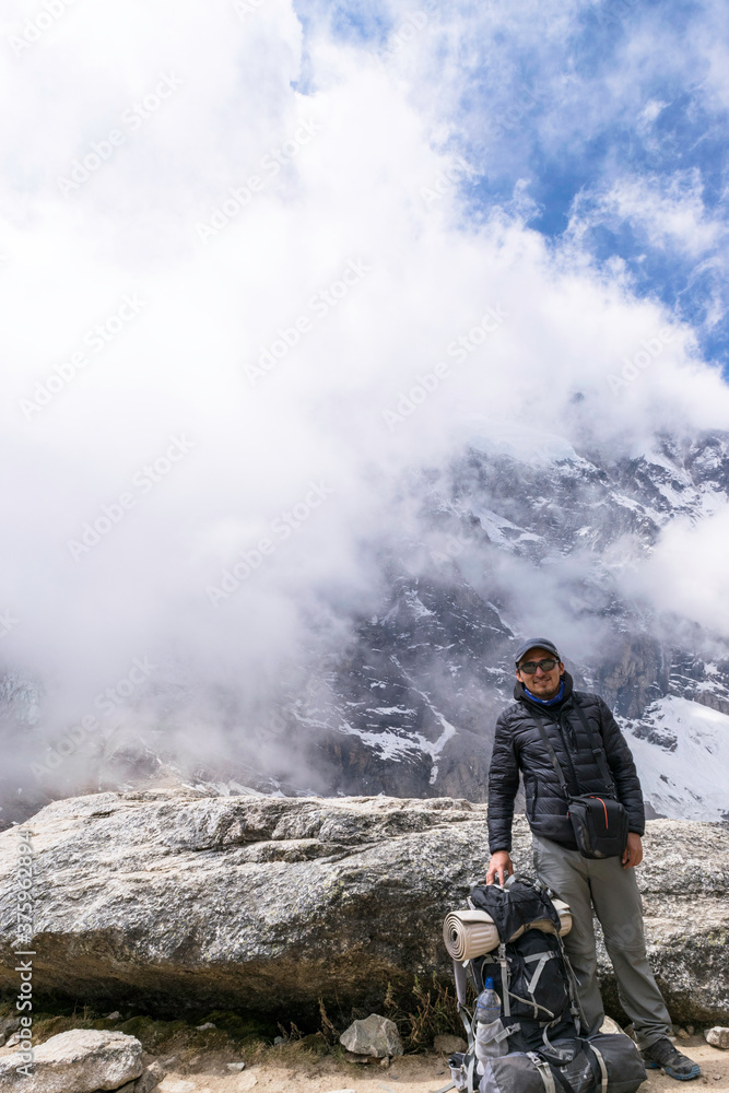 Backpacker enjoying the view in the way to machu picchu in the Salkantay trek, Peru Backpacker enjoying the view in the way to machu picchu in the Salkantay trek, Peru