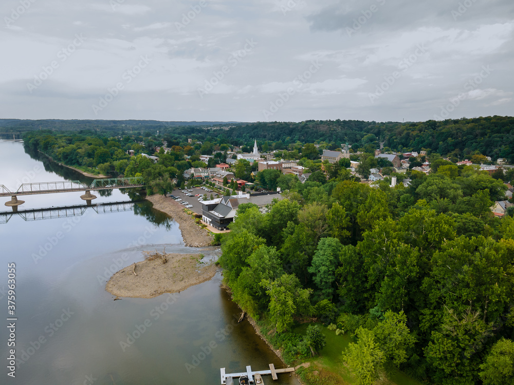 The view of aerial Delaware river, bridge across the in the historic city New Hope Pennsylvania and Lambertville New Jersey US The view of aerial Delaware river, bridge across the in the historic city New Hope Pennsylvania and Lambertville New Jersey US