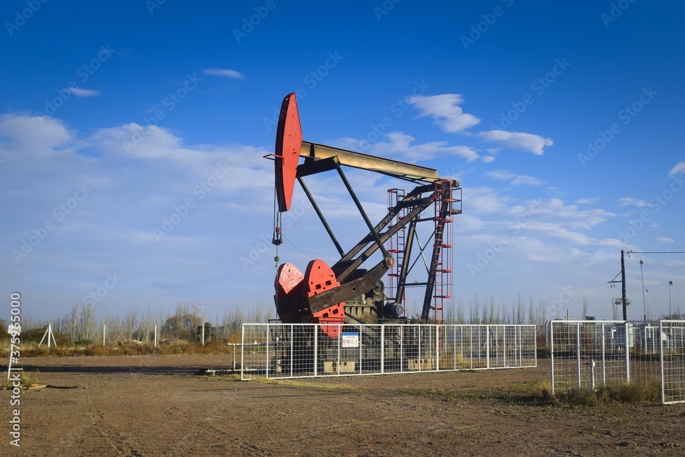 Oil extraction pumpjack in the desert of Mendoza, Argentina. Oil extraction pumpjack in the desert of Mendoza, Argentina.