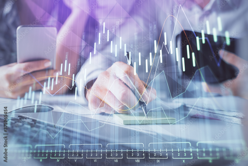 Double exposure of man and woman working together and financial graph hologram. Business concept. Computer background. Double exposure of man and woman working together and financial graph hologram. Business concept. Computer background.