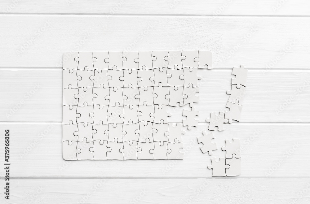 Top view of white jigsaw puzzle Top view of white jigsaw puzzle