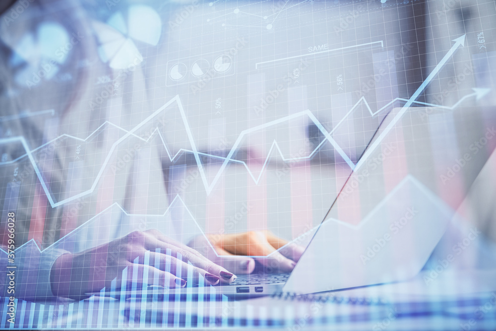 Double exposure of woman hands working on computer and forex graph hologram drawing. Financial analysis concept. Double exposure of woman hands working on computer and forex graph hologram drawing. Financial analysis concept.
