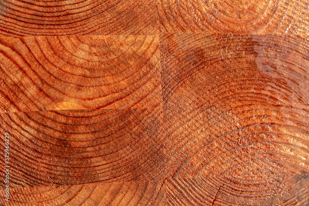 Naklejka premium Wet wooden background made of glued beams. Raw, unpolished. Texture.