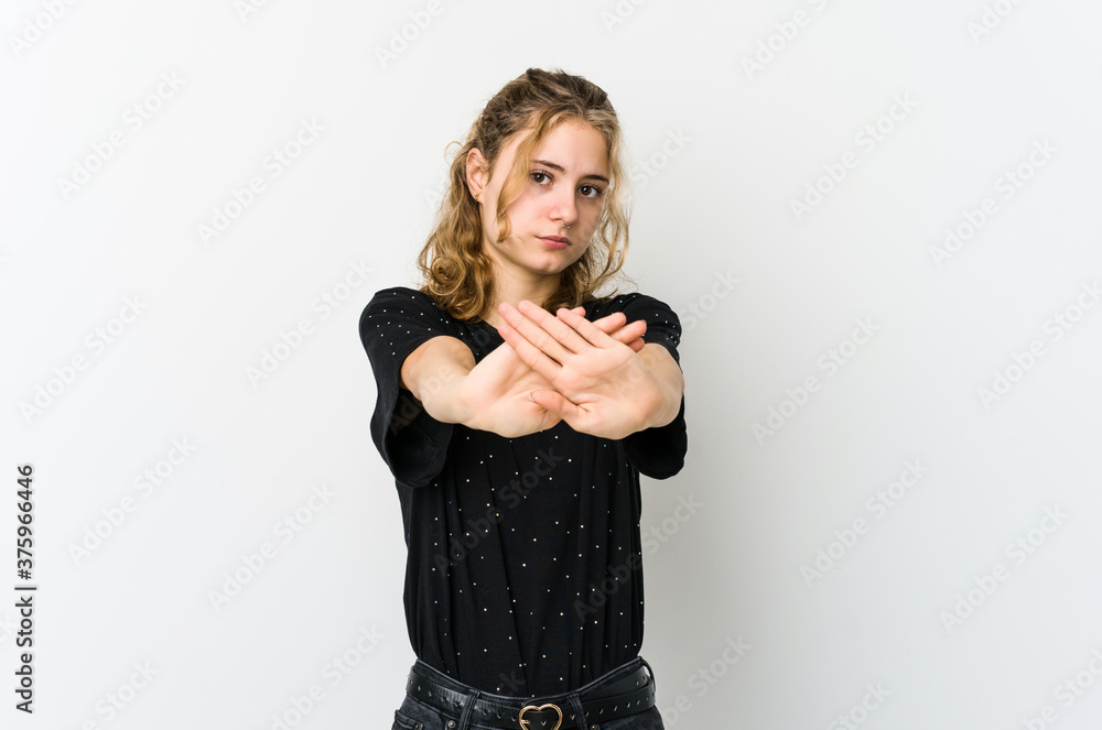 Young caucasian woman on white backrgound standing with outstretched hand showing stop sign, preventing you. Young caucasian woman on white backrgound standing with outstretched hand showing stop sign, preventing you.