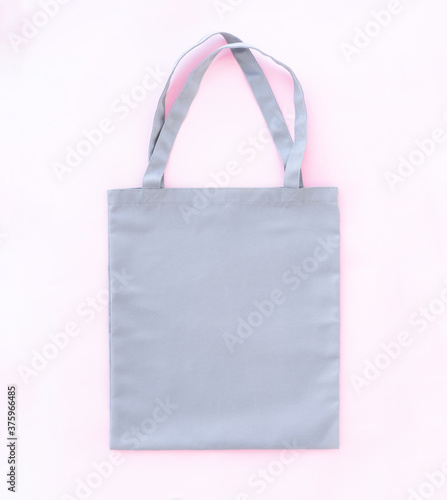 Light blank shopper bag on pink background