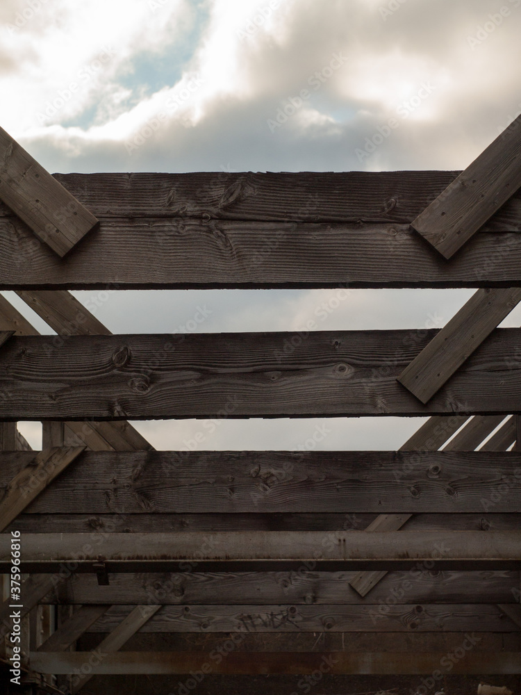old wooden fence with blue sky