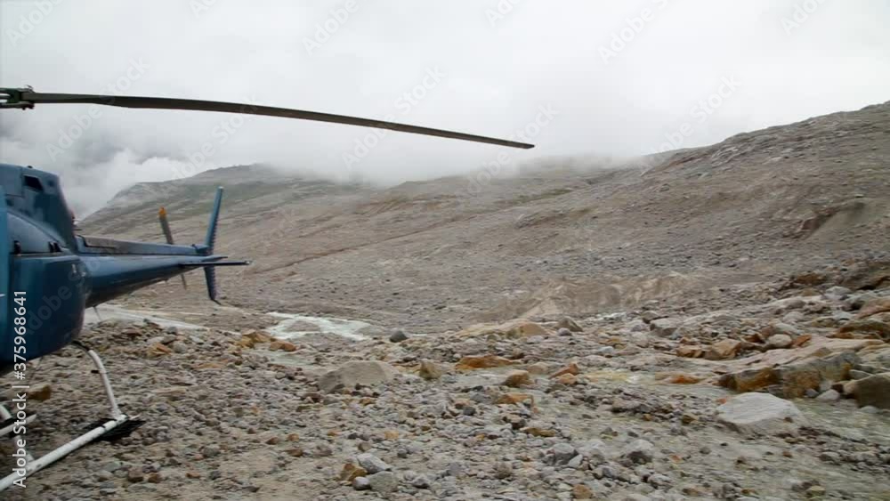 Helicopter at the base of a mountain glacier near Whistler, BC. HD 24FPS Helicopter at the base of a mountain glacier near Whistler, BC. HD 24FPS
