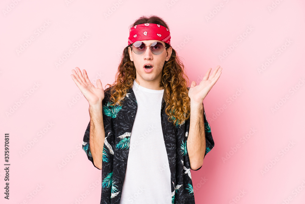 Young hippie caucasian man isolated surprised and shocked. Young hippie caucasian man isolated surprised and shocked.