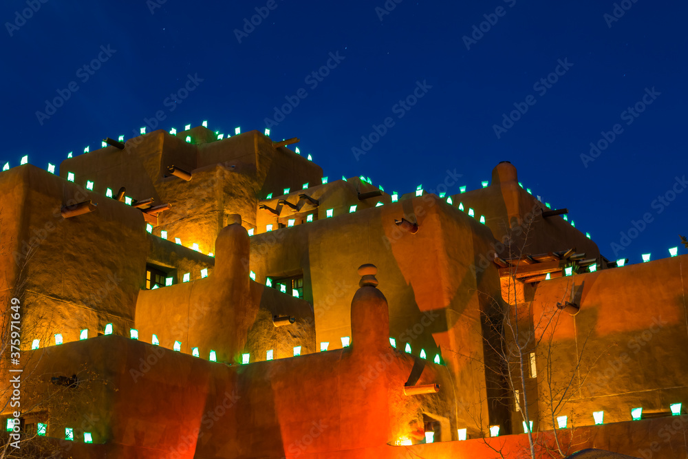 Naklejka premium Traditional Farolitos on Adobe Walls at Christmas, Santa Fe, New Mexico,USA