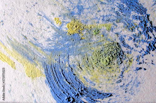 Abstract watercolor paint splash on paper background. Macro, close-up.
