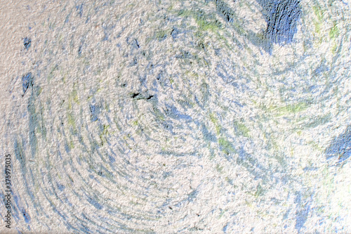 Abstract watercolor paint splash on paper background. Macro, close-up.