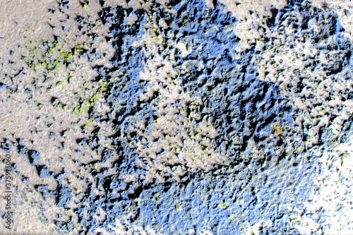 Abstract watercolor paint splash on paper background. Macro, close-up.