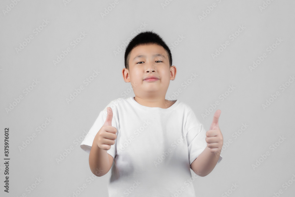 Asian boys studio portrait on gray background Asian boys studio portrait on gray background