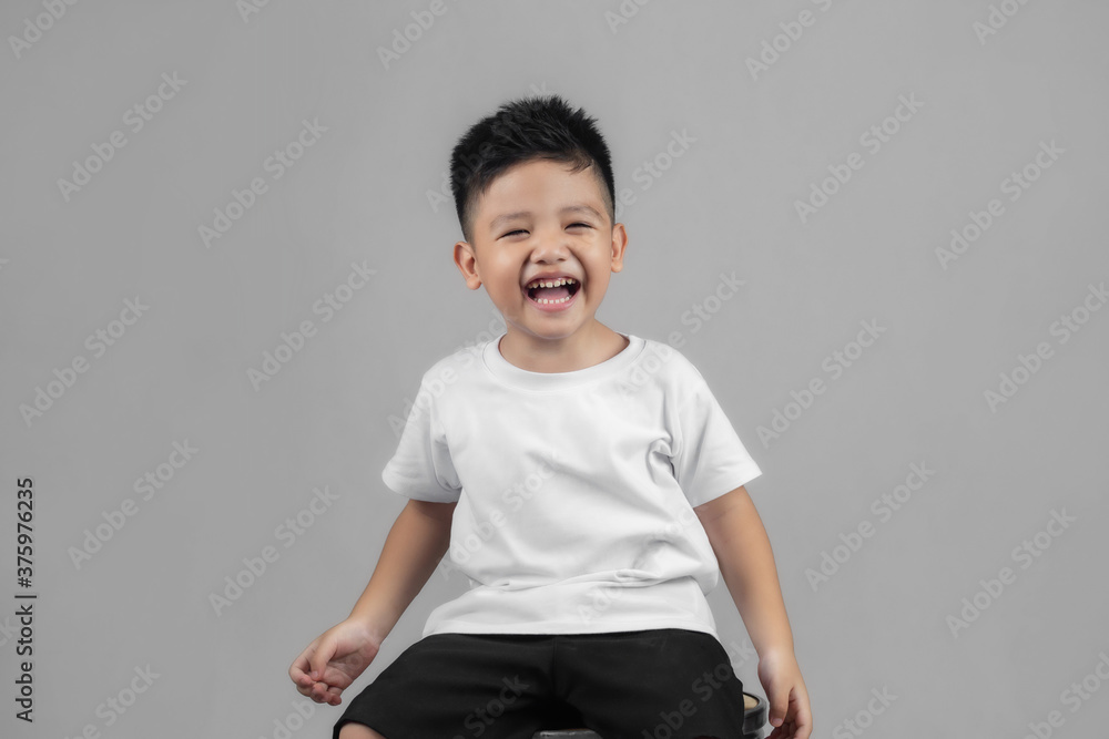 Asian boys studio portrait on gray background Asian boys studio portrait on gray background