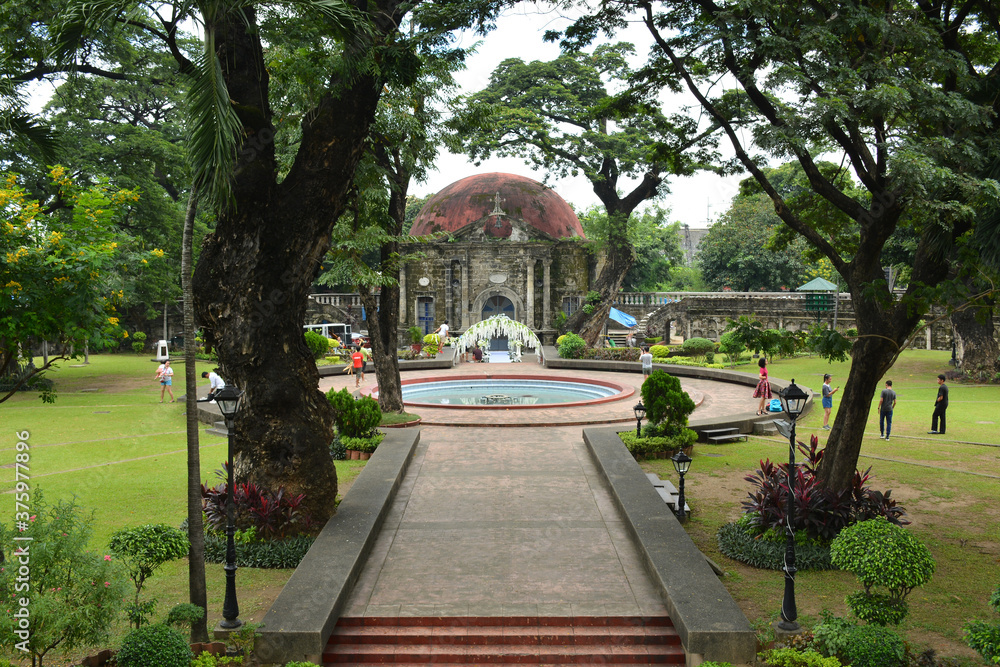 Saint Pancratius Chapel facade and water fountain at Paco park in Manila, Philippines