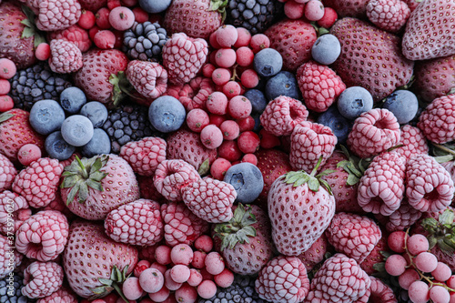 Mix of different frozen berries as background  top view