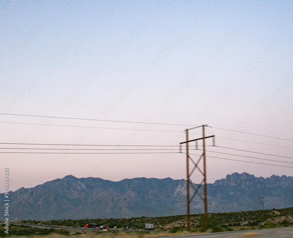 power line and mountains in the new mexican morning