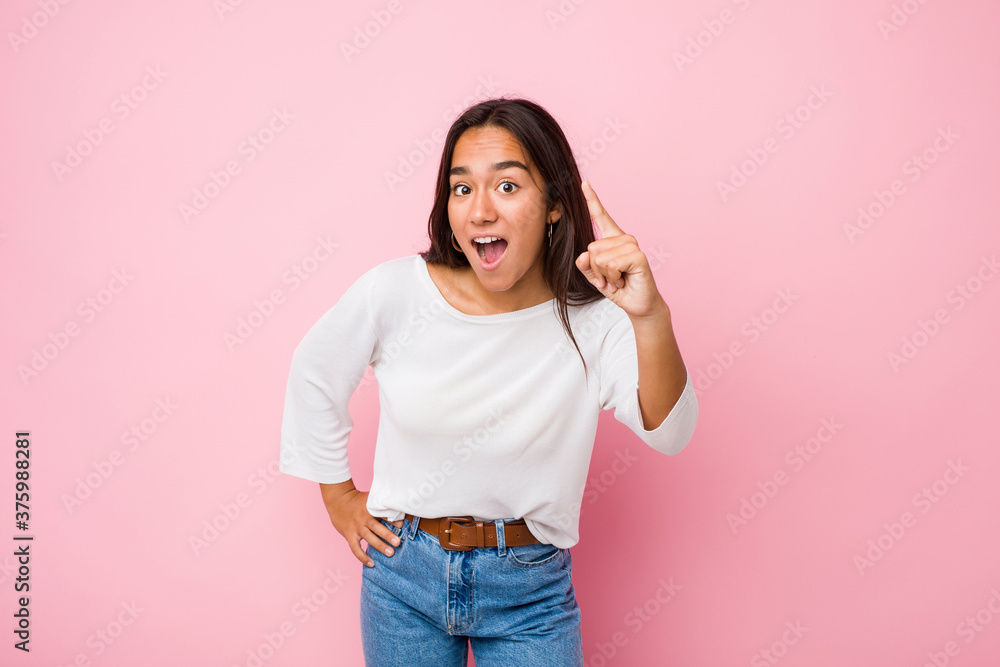 Young mixed race indian woman having an idea, inspiration concept. Young mixed race indian woman having an idea, inspiration concept.