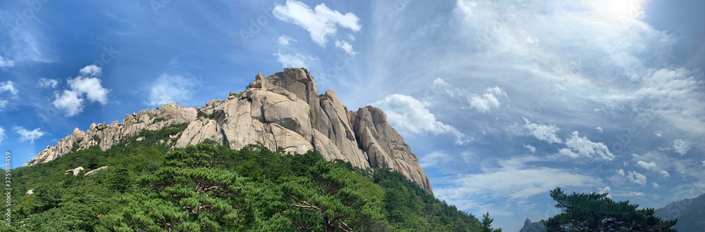 A panoramic view of Ulsan Bawi rock from below. Taken at Seoraksan National Park in Sokcho, Korea. A panoramic view of Ulsan Bawi rock from below. Taken at Seoraksan National Park in Sokcho, Korea.