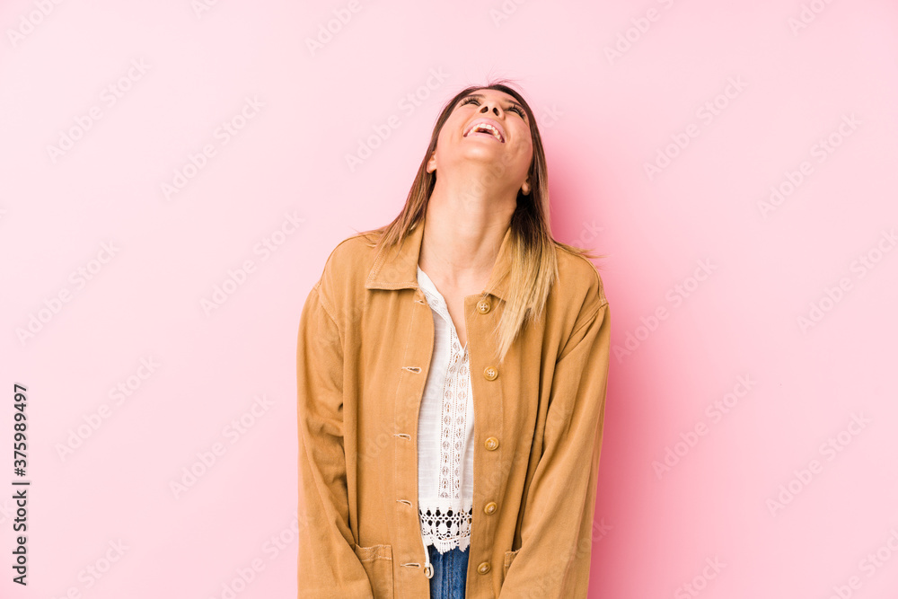 young caucasian woman posing isolated relaxed and happy laughing, neck stretched showing teeth.