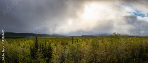 Beautiful Panoramic View of Canadian Nature Landscape during a sunny summer sunrise. Taken in Northern British Columbia, Canada. Nature Background Panorama