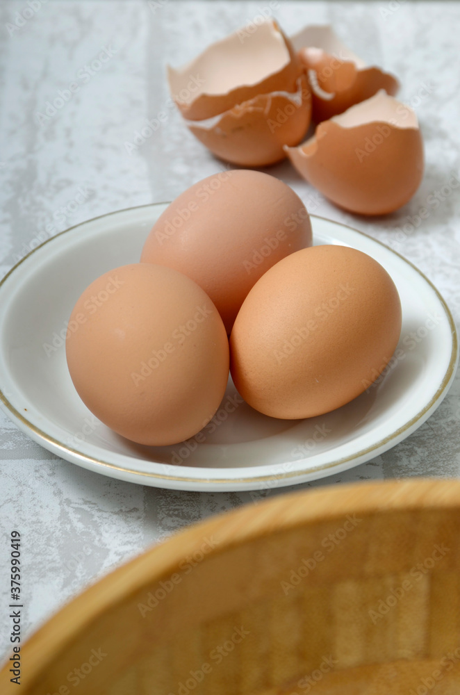 Three eggs in a white bowl Three eggs in a white bowl