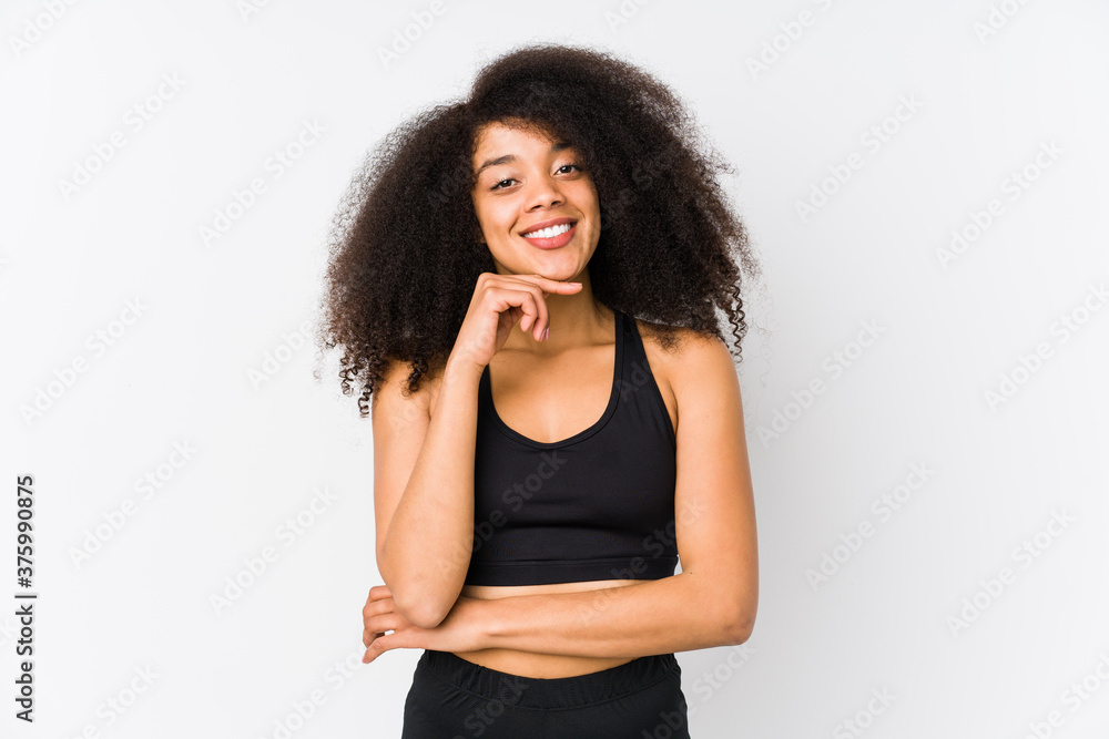 Young african american sporty woman smiling happy and confident, touching chin with hand. Young african american sporty woman smiling happy and confident, touching chin with hand.