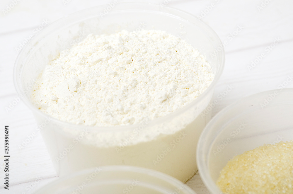wheat flour in plastic bowl for baking wheat flour in plastic bowl for baking