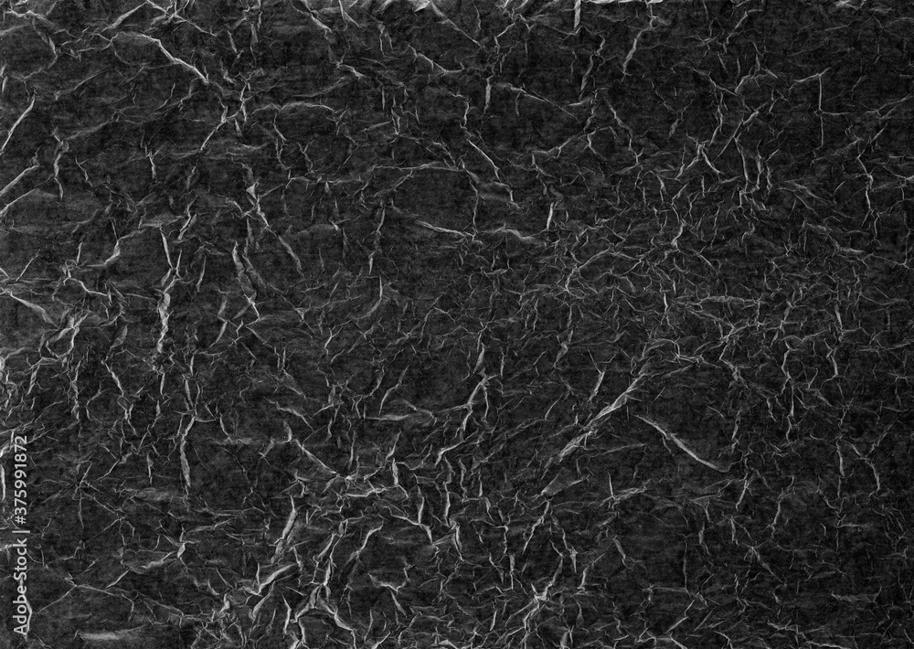 A gray scale abstract texture made using a scan of creased and crinkled tissue paper. Ideal as a background image. A gray scale abstract texture made using a scan of creased and crinkled tissue paper. Ideal as a background image.