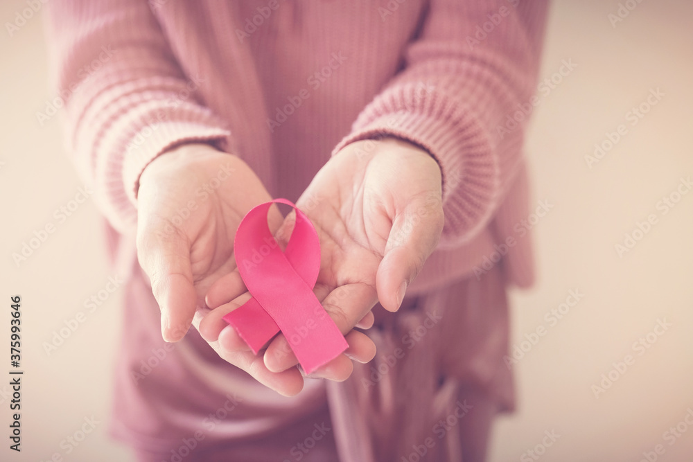woman wearing pink top with pink ribbon, breast cancer awareness, October pink, World cancer day concept - obrazy, fototapety, plakaty 
