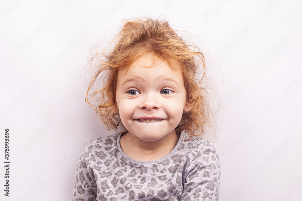 portrait of a happy little red-haired girl isolated on white background portrait of a happy little red-haired girl isolated on white background