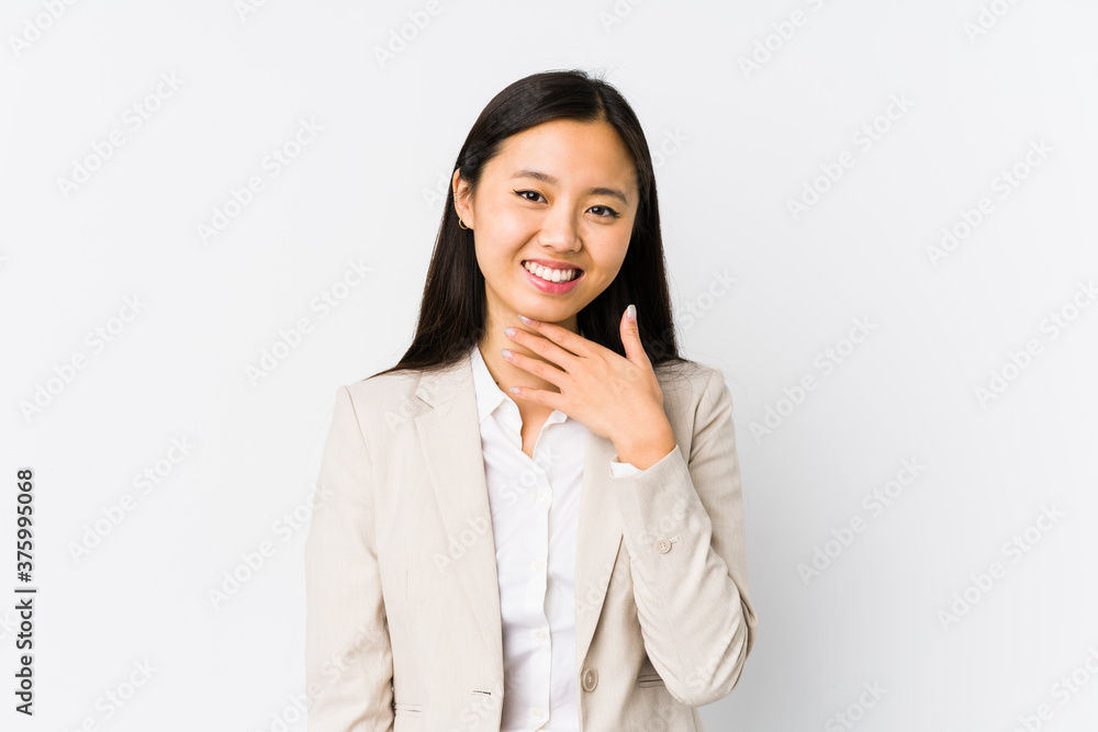 Young chinese business woman isolated laughs out loudly keeping hand on chest. Young chinese business woman isolated laughs out loudly keeping hand on chest.