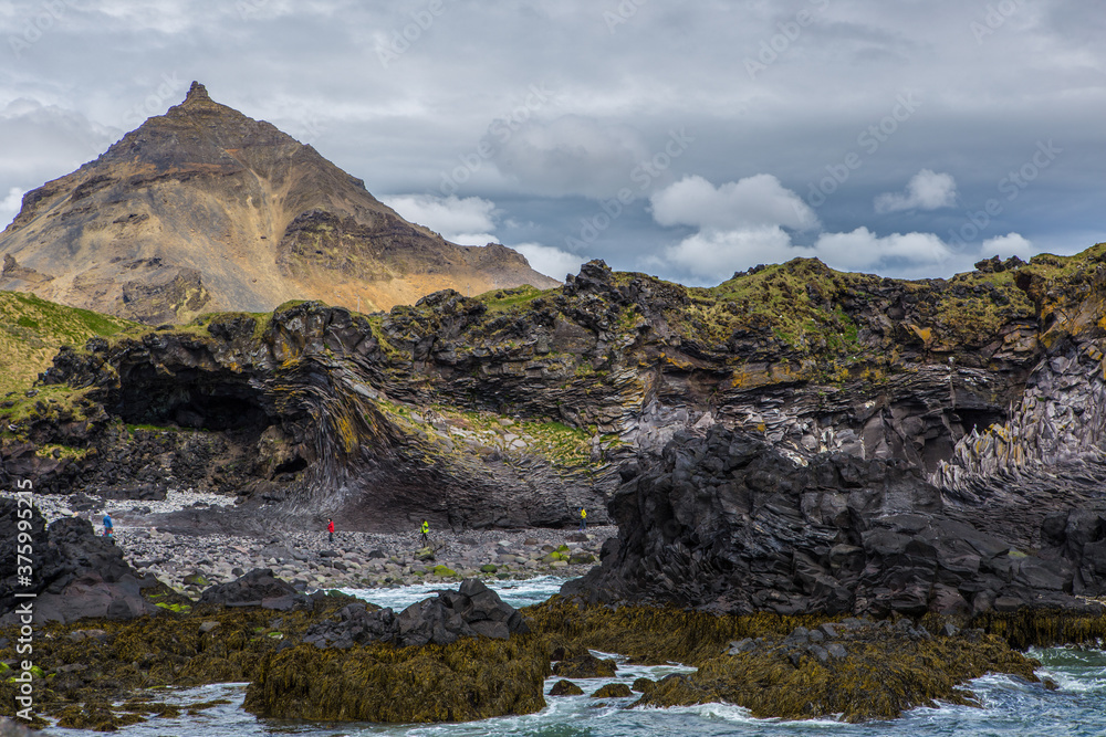 The volcanic black basalt landscape at the coast of Hellnar, a small town in Snaefellsnes, Iceland.