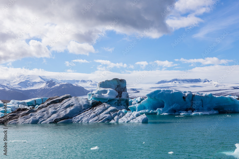 Jokulsarlon Lagoon, a blue glacier lagoon at the south coast of Iceland, on summer time, at a sunny day.
