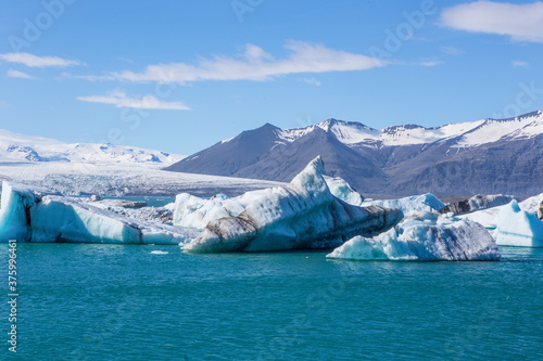 Jokulsarlon Lagoon, a blue glacier lagoon at the south coast of Iceland, on summer time, at a sunny day.