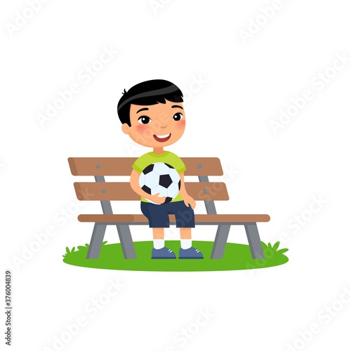 Little asian boy with soccer ball in his hands sits on bench. Summer holidays, recreation, sports, hobbies. Vector flat illustration. Child cartoon character isolated on white background.