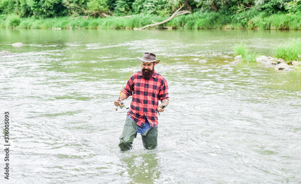be successful. hobby and sport activity. bearded fisher in water. fisherman show fishing technique use rod. mature man fly fishing. man catching fish. summer weekend. Successful fly fishing be successful. hobby and sport activity. bearded fisher in water. fisherman show fishing technique use rod. mature man fly fishing. man catching fish. summer weekend. Successful fly fishing