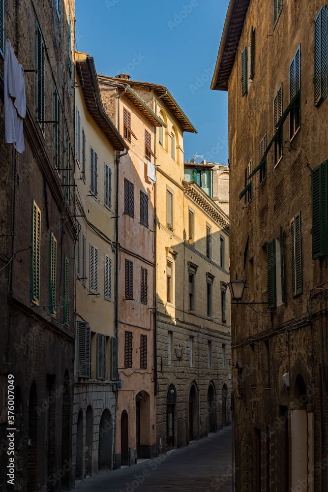 Lonely street at the old town of Siena, Tuscany Region in Italy 