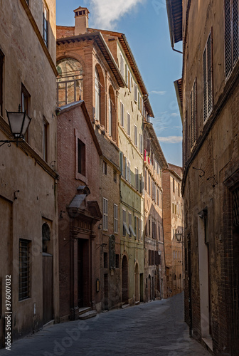 Narrow street at the old town of Siena, Tuscany Region in Italy 