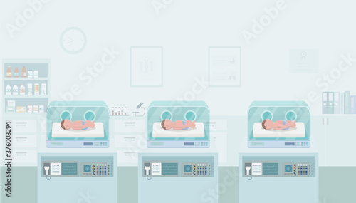Newborn babies in incubators