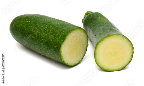 Stack fresh green zucchini isolated on white background 