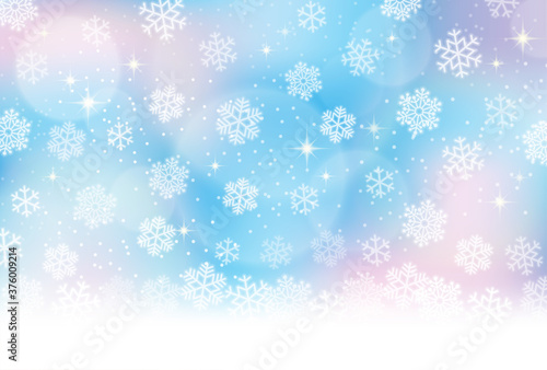 雪の結晶、冬のイメージの水色背景素材