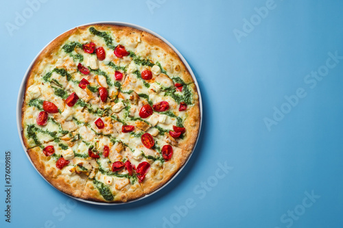 Closeup of freshly baked pizza in restaurant.