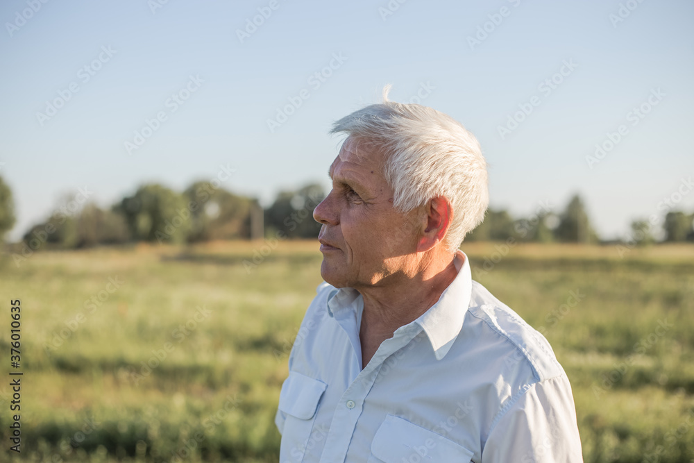 Happy senior man. Portrait of old pensioner man in the meadow. Happy senior man. Portrait of old pensioner man in the meadow.