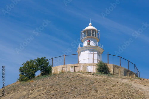 The lighthouse at cape Meganom, Crimea. photo