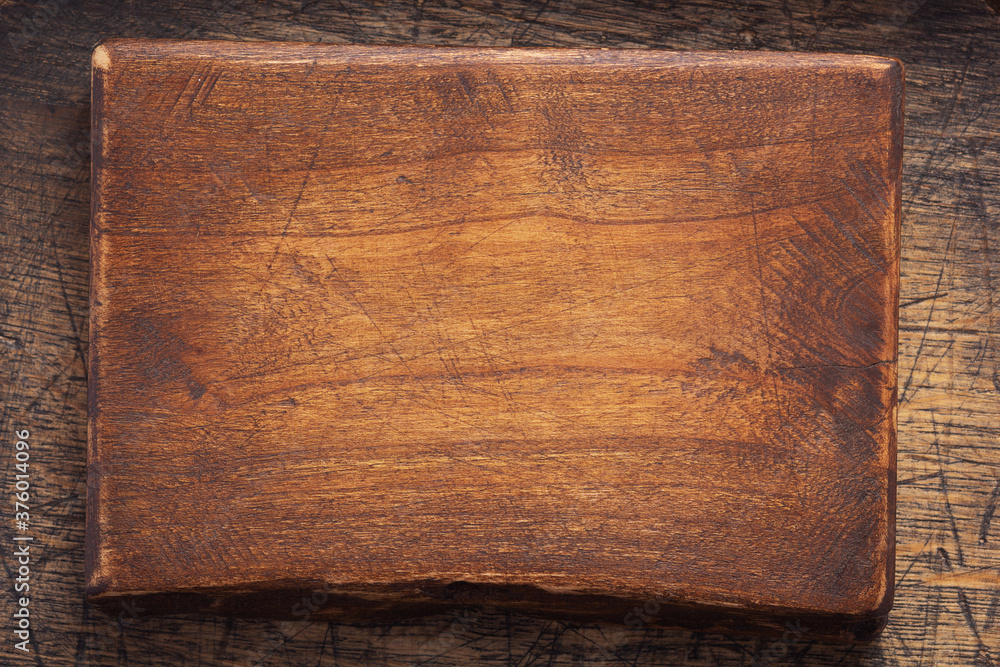 aged wooden nameplate at wood board background aged wooden nameplate at wood board background