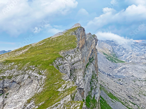 Alpine peak Chli Hohmad above the Tannensee lake (or Tannen lake) and in the Uri Alps mountain massif, Melchtal - Canton of Obwald, Switzerland (Kanton Obwalden, Schweiz) photo