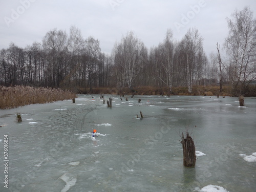 Moscow region/Russia - december 2019: Ice-fishing on the river