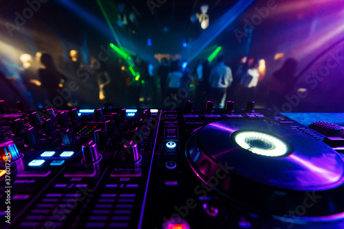 professional DJ mixer controller for mixing music in a nightclub