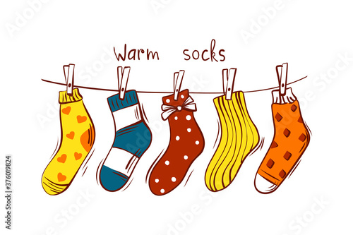 Scandinavian interior - hanging gift socks on an isolated background. Cozy winter holiday season. Cute in the style of Hygge. Vector.